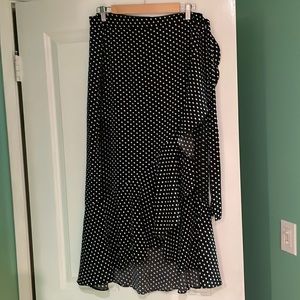 Max studio black with white polka dots wrap skirt. It’s brand new -size Large .
